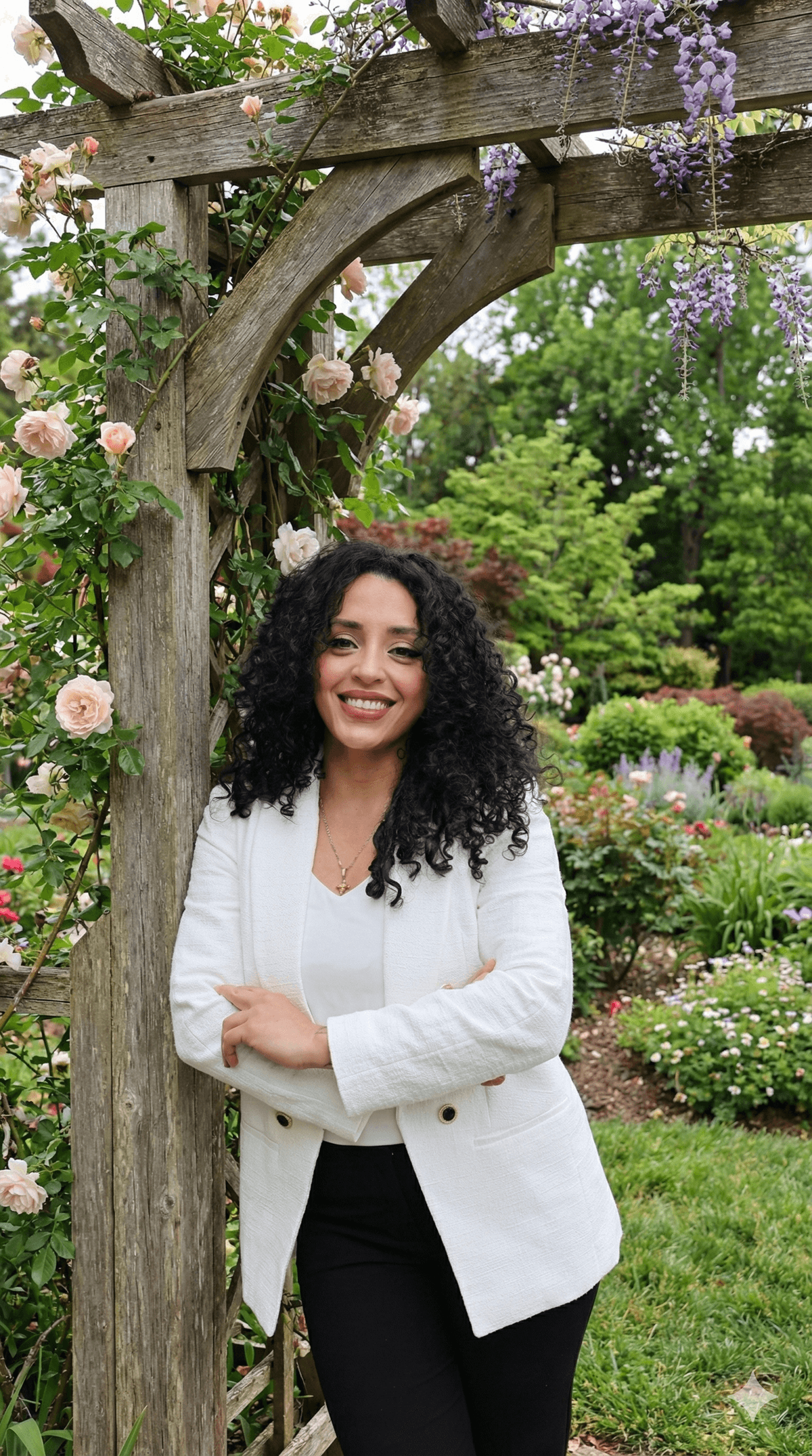 Michi Sanchez standing in a garden